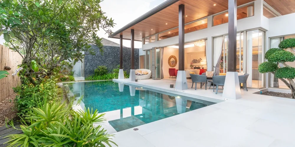 home-house-exterior-design-showing-tropical-pool-villa-with-greenery-garden